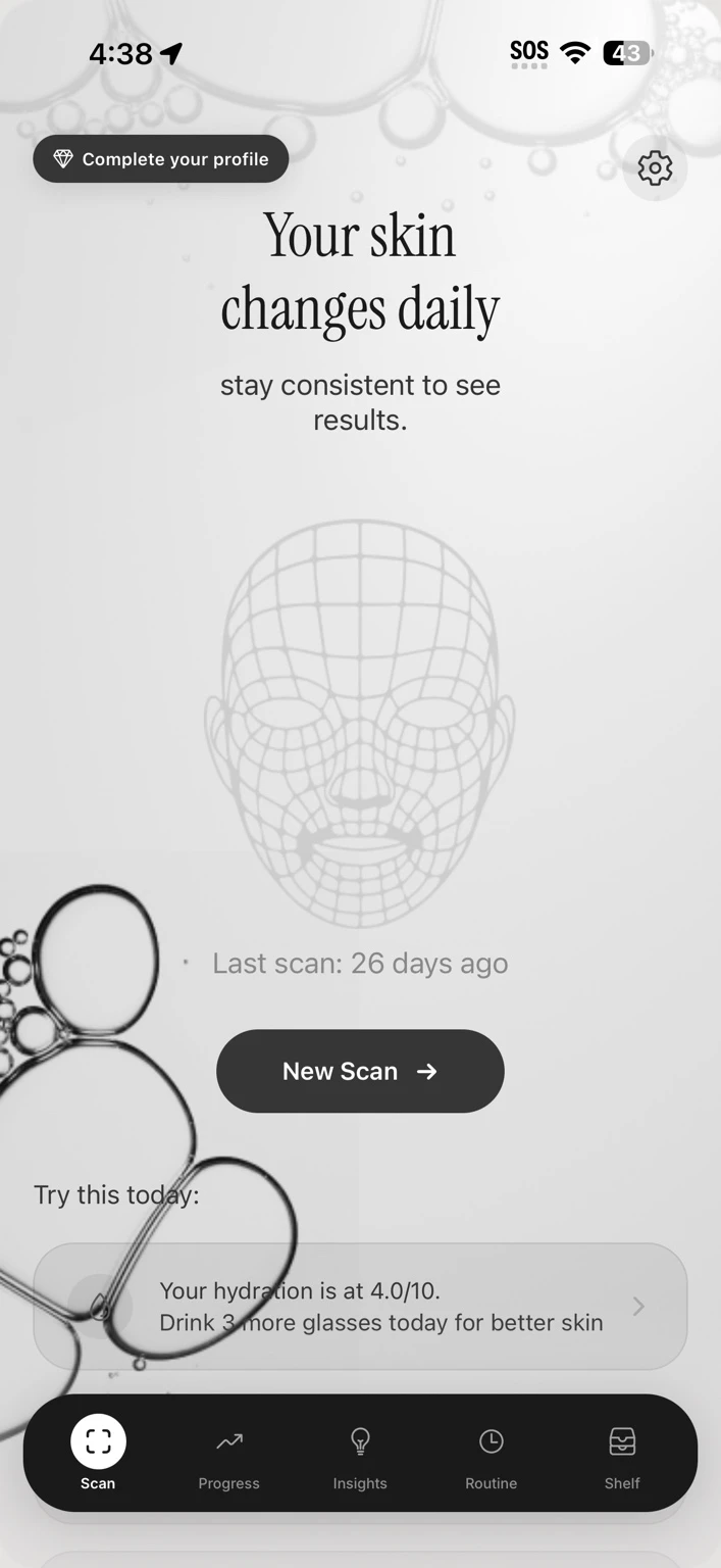 FaceCard home screen with a New Scan button and daily skin guidance